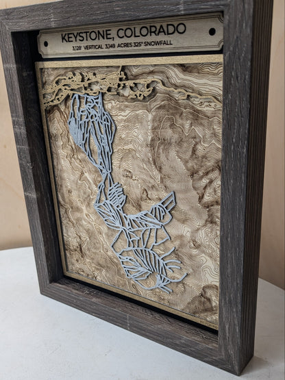 Wooden map of Colorado with 'Keystone, Colorado' on a wooden plaque.
