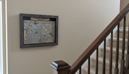 Framed map of Littleton, Colorado on a white surface with a beige wall background