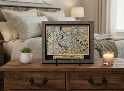 Framed map of Rome, Italy on a wooden surface